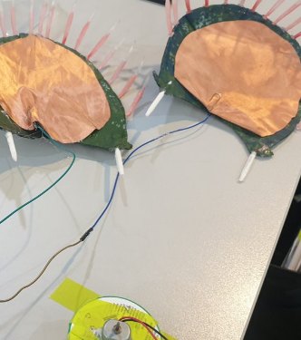 Two petals covered with copper tape, wired up.